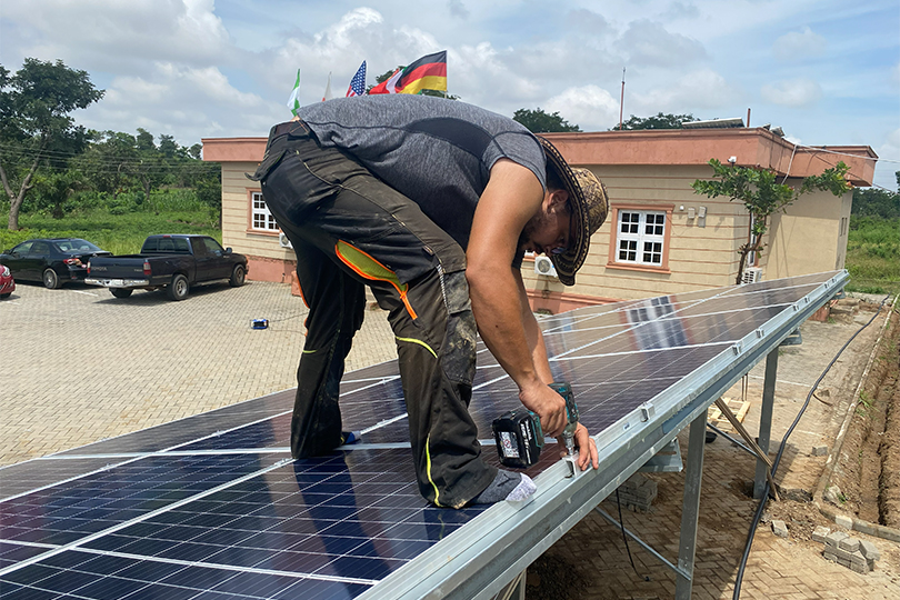 man installing solar panels